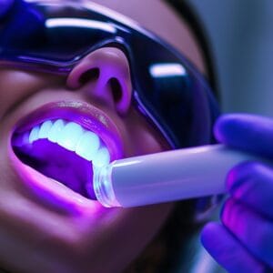 A woman getting her teeth whitened in clinic